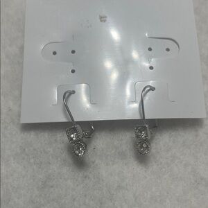 Drop earrings with clear gemstones.